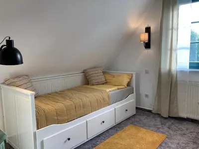 Ein Bett oder Betten in einem Zimmer der Unterkunft Lütt Klönhus