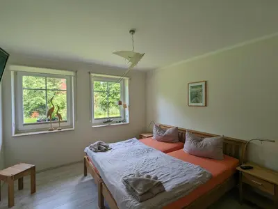Ein Bett oder Betten in einem Zimmer der Unterkunft An de Bäk - Dine
