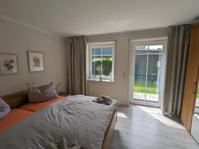 Ein Bett oder Betten in einem Zimmer der Unterkunft An de Bäk - Dine