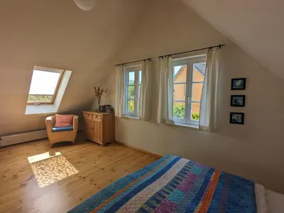 Ein Bett oder Betten in einem Zimmer der Unterkunft Boddenblick