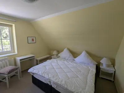 Ein Bett oder Betten in einem Zimmer der Unterkunft Boddenland 1