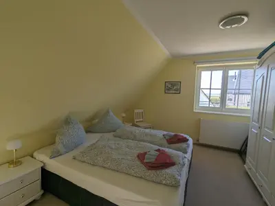 Ein Bett oder Betten in einem Zimmer der Unterkunft Boddenland 2