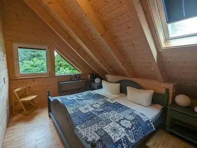 Ein Bett oder Betten in einem Zimmer der Unterkunft Borner Holzhaus