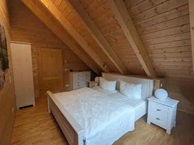 Ein Bett oder Betten in einem Zimmer der Unterkunft Borner Holzhaus