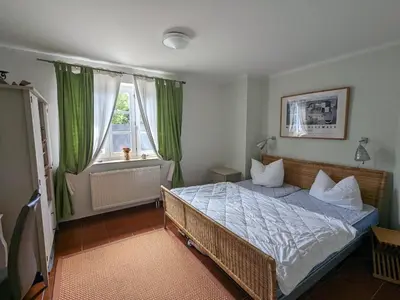Ein Bett oder Betten in einem Zimmer der Unterkunft Tulpe