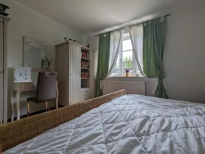 Ein Bett oder Betten in einem Zimmer der Unterkunft Tulpe