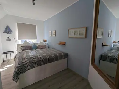 Ein Bett oder Betten in einem Zimmer der Unterkunft Störtebeker