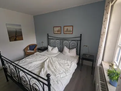 Ein Bett oder Betten in einem Zimmer der Unterkunft Störtebeker
