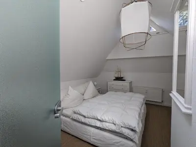 Ein Bett oder Betten in einem Zimmer der Unterkunft Schwalbennest
