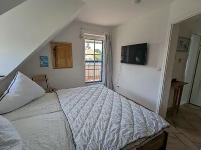 Ein Bett oder Betten in einem Zimmer der Unterkunft Nordstern
