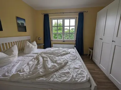 Ein Bett oder Betten in einem Zimmer der Unterkunft Likedeeler