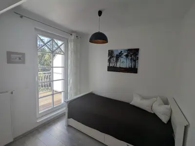 Ein Bett oder Betten in einem Zimmer der Unterkunft Dünenrose