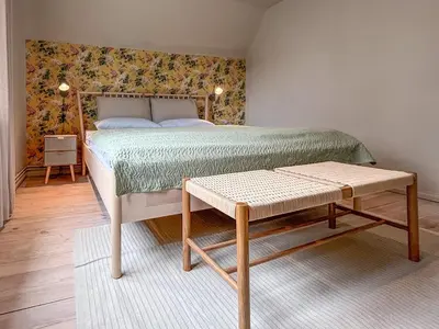 Ein Bett oder Betten in einem Zimmer der Unterkunft Haus Sommerfreuden