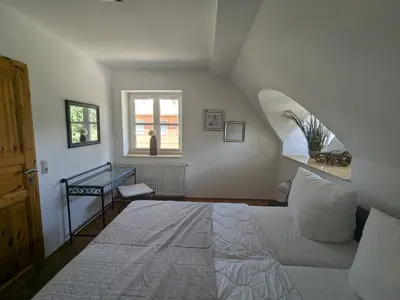 Ein Bett oder Betten in einem Zimmer der Unterkunft Haus Meer