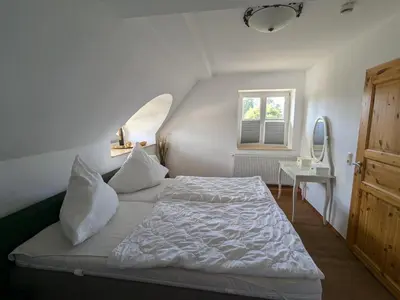 Ein Bett oder Betten in einem Zimmer der Unterkunft Haus Sonne
