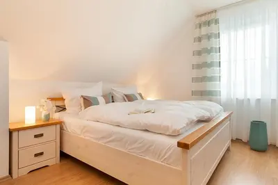Ein Bett oder Betten in einem Zimmer der Unterkunft Schickes Ferienhaus Ostseeperle, 3 Schlafz., 2 Bäder