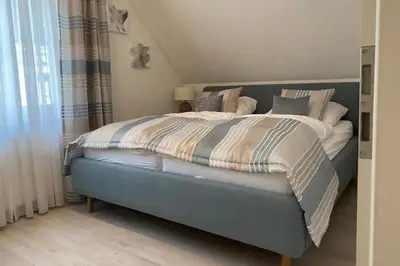 Ein Bett oder Betten in einem Zimmer der Unterkunft Schickes Ferienhaus Ostseeperle, 3 Schlafz., 2 Bäder