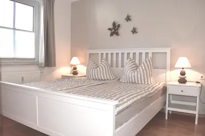 Ein Bett oder Betten in einem Zimmer der Unterkunft Fritz-Reuter-Straße 4 Wohnung de Strandläufer