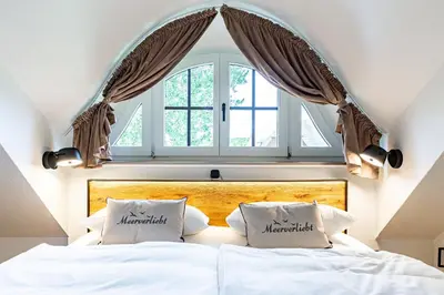 Ein Bett oder Betten in einem Zimmer der Unterkunft Boddenblick 1