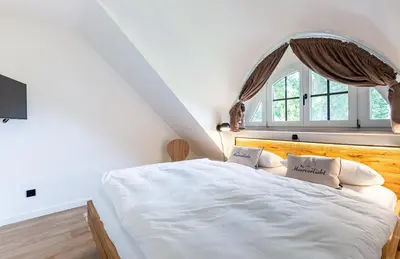 Ein Bett oder Betten in einem Zimmer der Unterkunft Boddenblick 1