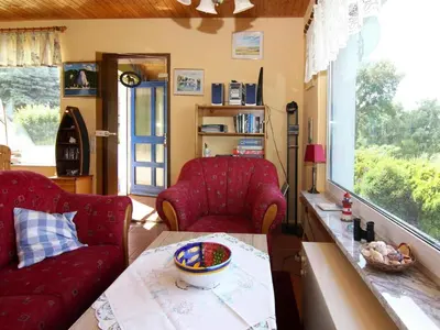 Ein Sitzbereich in der Unterkunft Ferienhaus am Schilfufer in Barth