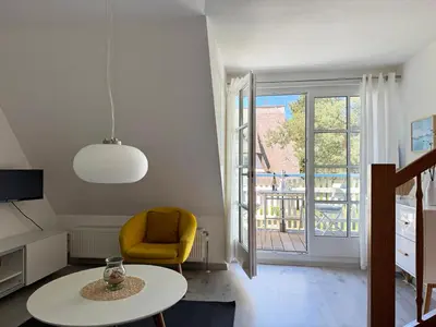 Ein Sitzbereich in der Unterkunft Achtern Diek Haus 11 Wohnung 7 