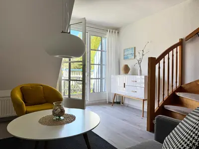 Ein Sitzbereich in der Unterkunft Achtern Diek Haus 11 Wohnung 7 