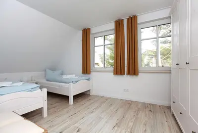 Ein Bett oder Betten in einem Zimmer der Unterkunft Haus Eichkater