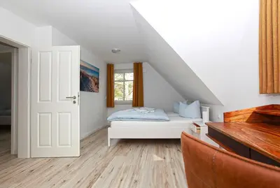 Ein Bett oder Betten in einem Zimmer der Unterkunft Haus Eichkater