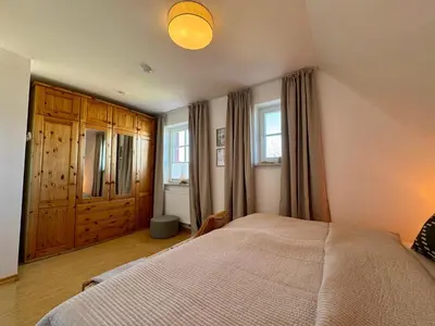 Ein Bett oder Betten in einem Zimmer der Unterkunft Ferienhaus Chausseestraße App 02