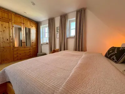 Ein Bett oder Betten in einem Zimmer der Unterkunft Ferienhaus Chausseestraße App 02