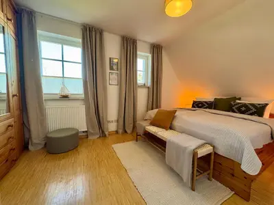 Ein Bett oder Betten in einem Zimmer der Unterkunft Ferienhaus Chausseestraße App 02