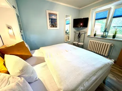 Ein Bett oder Betten in einem Zimmer der Unterkunft FERIENWOHNUNGEN Krull App 02