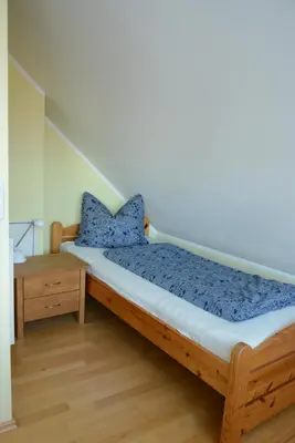 Ein Bett oder Betten in einem Zimmer der Unterkunft Min Hüsken