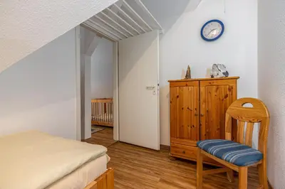 Ein Bett oder Betten in einem Zimmer der Unterkunft Haus Seeschwalbe Wohnung 5