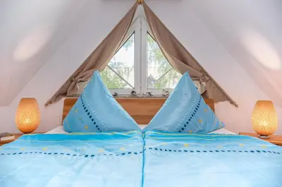 Ein Bett oder Betten in einem Zimmer der Unterkunft Haus Seeschwalbe Wohnung 5