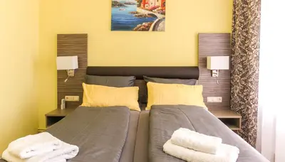 Ein Bett oder Betten in einem Zimmer der Unterkunft Restaurant & Pension Eshramo