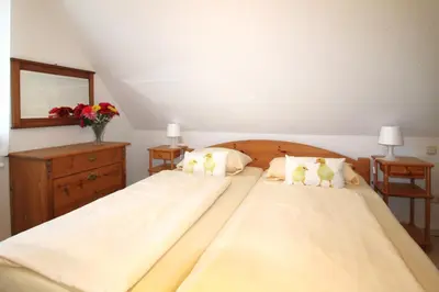 Ein Bett oder Betten in einem Zimmer der Unterkunft Ferienhaus Krull - Davids Ferienwohnung