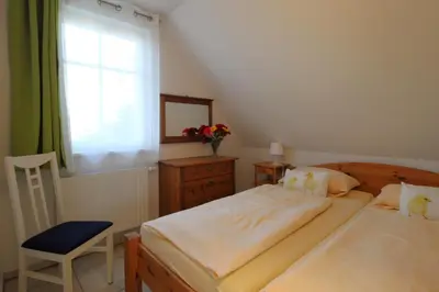 Ein Bett oder Betten in einem Zimmer der Unterkunft Ferienhaus Krull - Davids Ferienwohnung