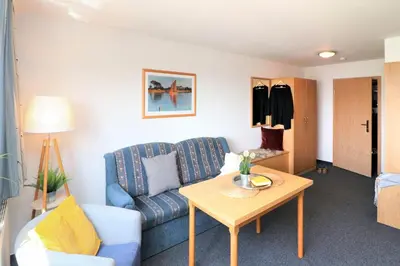 Ein Sitzbereich in der Unterkunft Deutsches Haus Zimmer 37