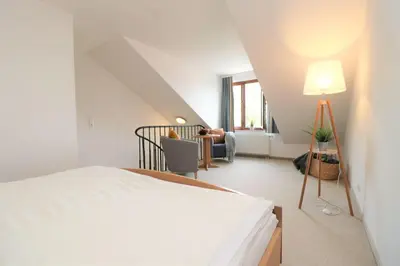Ein Bett oder Betten in einem Zimmer der Unterkunft Deutsches Haus Zimmer 37
