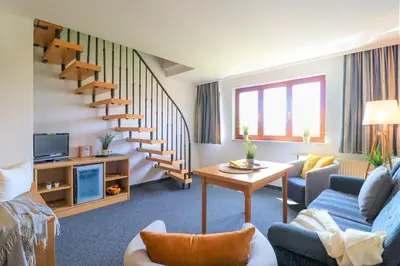 Ein Sitzbereich in der Unterkunft Deutsches Haus Zimmer 33