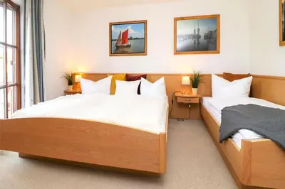 Ein Bett oder Betten in einem Zimmer der Unterkunft Deutsches Haus Zimmer 38