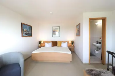 Ein Bett oder Betten in einem Zimmer der Unterkunft Deutsches Haus Zimmer 36