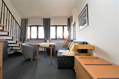 Ein Sitzbereich in der Unterkunft Deutsches Haus Zimmer 36
