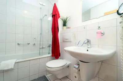 Ein Badezimmer in der Unterkunft Deutsches Haus Zimmer 28