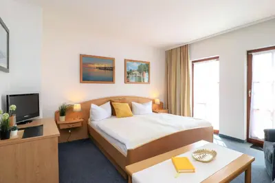 Ein Bett oder Betten in einem Zimmer der Unterkunft Deutsches Haus Zimmer 24