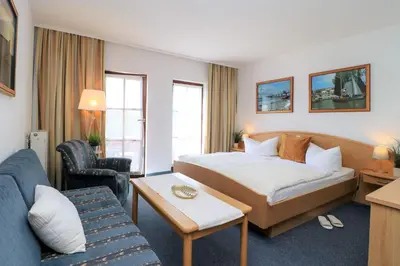 Ein Bett oder Betten in einem Zimmer der Unterkunft Deutsches Haus Zimmer 22