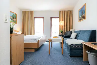 Ein Bett oder Betten in einem Zimmer der Unterkunft Deutsches Haus Zimmer 16