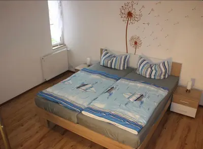 Ein Bett oder Betten in einem Zimmer der Unterkunft zum Schilfrohr